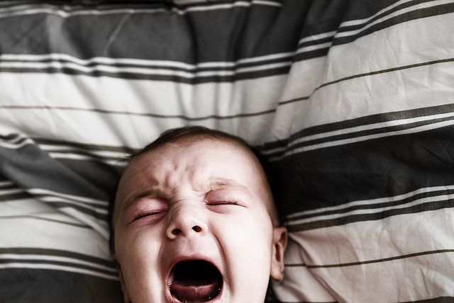 Baby crying in bed after applied kinesiology